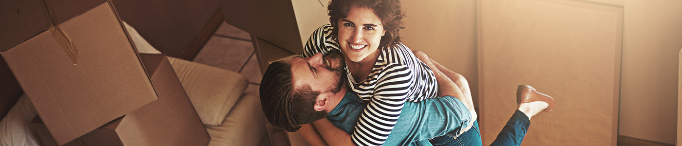 couple hugging in new home